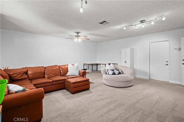 living room with ceiling fan, light colored carpet, and ornamental molding