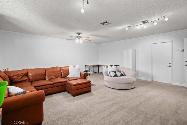 carpeted living room featuring ceiling fan, crown molding, and a textured ceiling