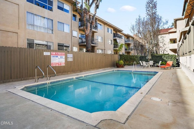 view of swimming pool with a patio area