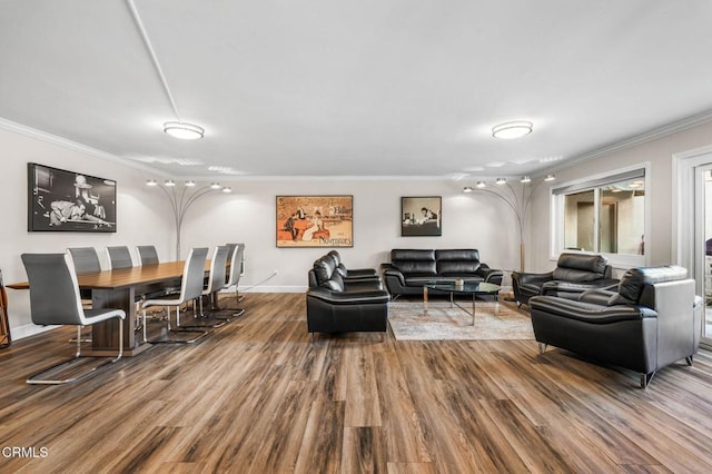 living room with crown molding and hardwood / wood-style floors