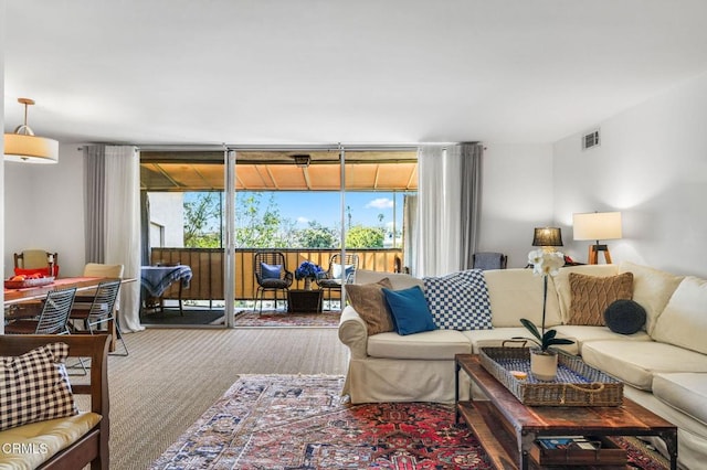 living room featuring a wall of windows