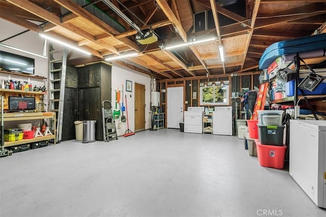 garage featuring washer and dryer, water heater, and a garage door opener