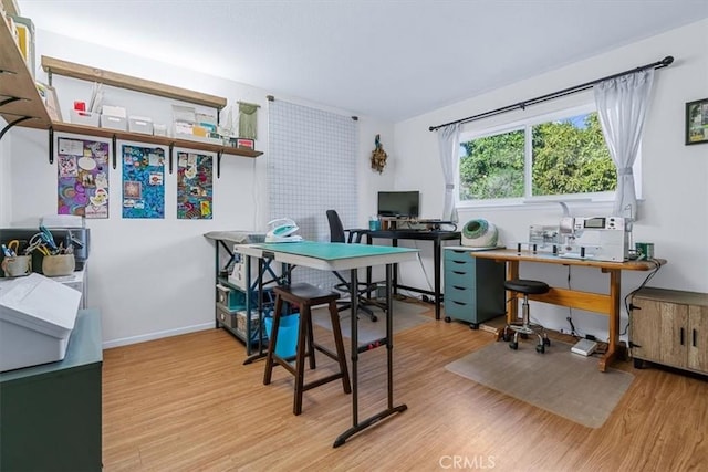 office space with wood-type flooring