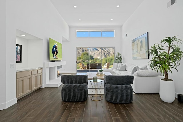 living room with a high ceiling