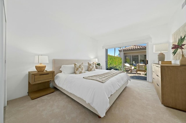 carpeted bedroom featuring access to outside