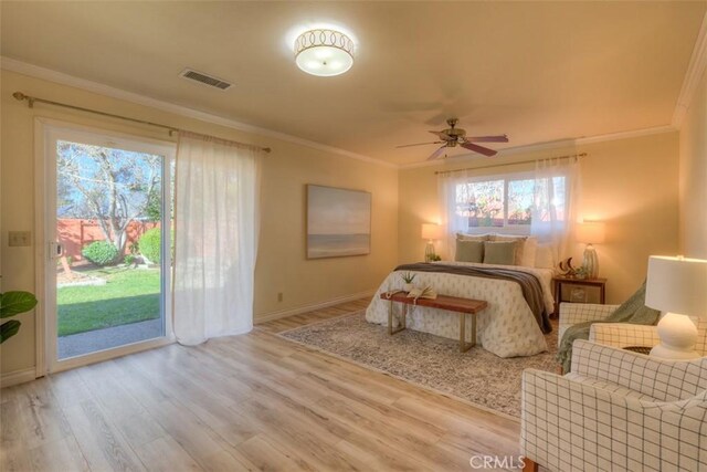 bedroom featuring ceiling fan, ornamental molding, access to exterior, and light wood-type flooring