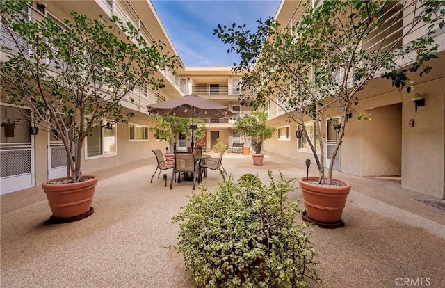 surrounding community featuring a patio area