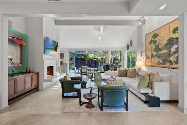 living room featuring lofted ceiling with beams