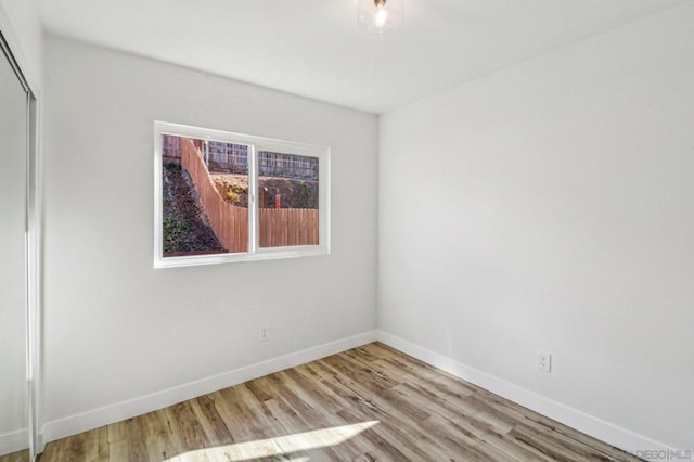 unfurnished room featuring light hardwood / wood-style floors