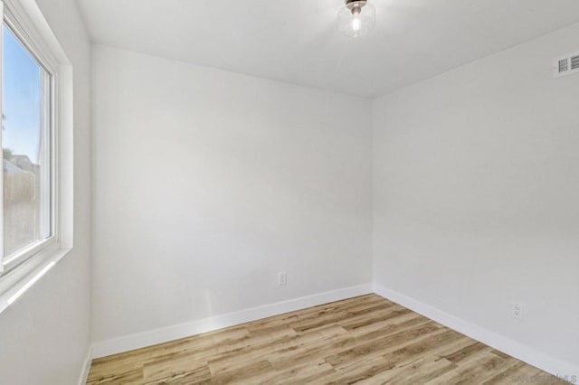 unfurnished room with light hardwood / wood-style floors