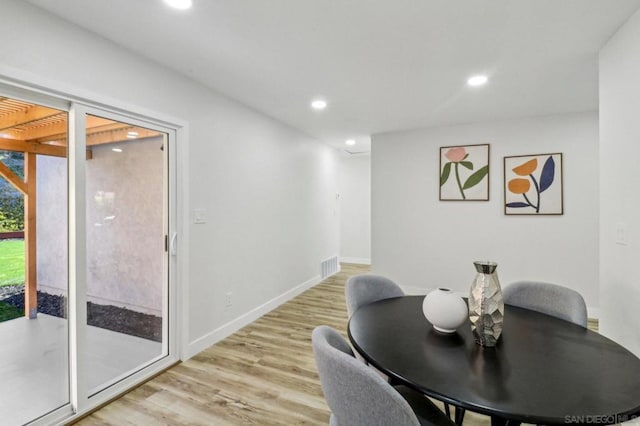 dining space featuring light hardwood / wood-style flooring