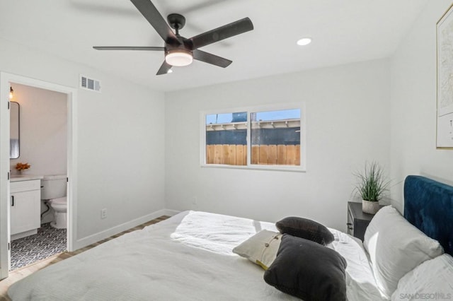 bedroom featuring ensuite bathroom, ceiling fan, and light hardwood / wood-style floors