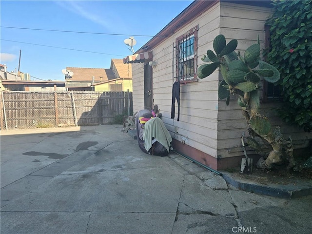 view of side of home featuring a patio