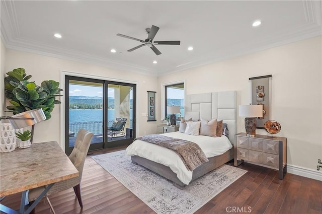 bedroom with hardwood / wood-style floors, a water view, ceiling fan, ornamental molding, and access to outside