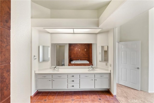 bathroom featuring vanity, tile patterned flooring, toilet, and a tub