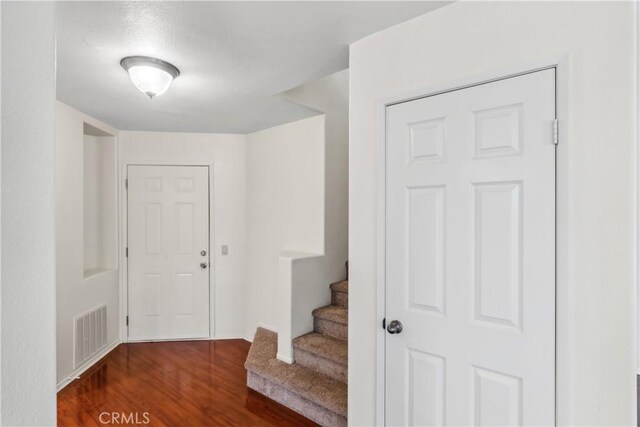 entrance foyer featuring dark wood-type flooring