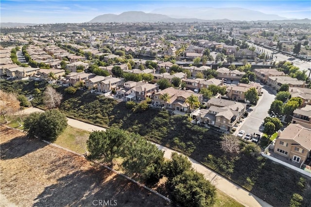 birds eye view of property with a mountain view