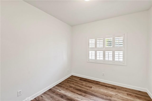 unfurnished room featuring wood-type flooring