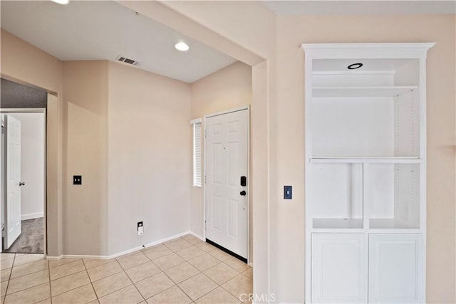 foyer with light tile patterned flooring