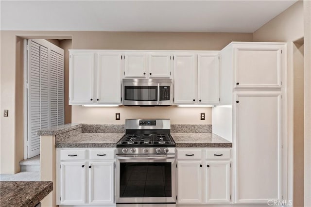 kitchen with stainless steel appliances and white cabinetry