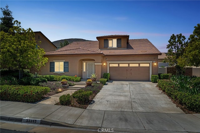 33312 Hitching Post Dr, Winchester, CA 92596 - mediterranean / spanish-style home with stucco siding, a tiled roof, concrete driveway, and a garage