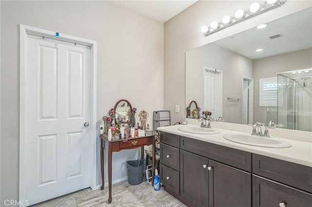 33312 Hitching Post Dr, Winchester, CA 92596 - bathroom with a shower stall and double vanity