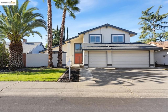 view of front facade featuring a front lawn and a garage