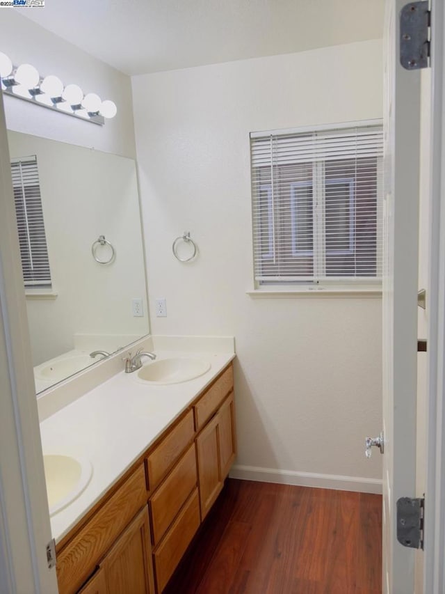 bathroom featuring vanity and hardwood / wood-style floors