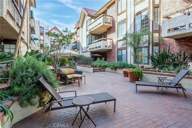 view of property's community featuring a patio area