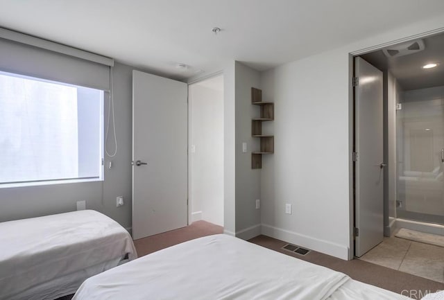 bedroom featuring ensuite bath