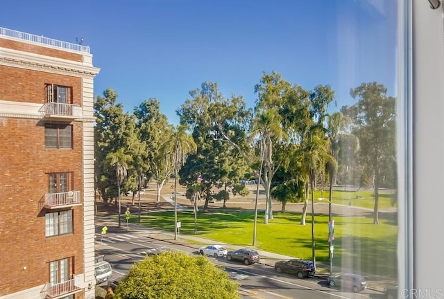 view of property's community with a lawn