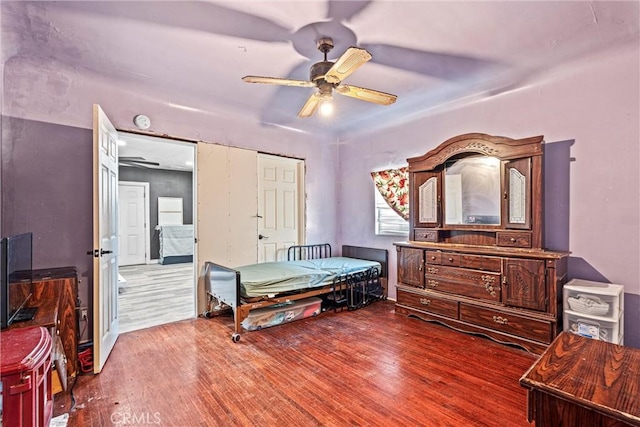 bedroom featuring ceiling fan and wood-type flooring