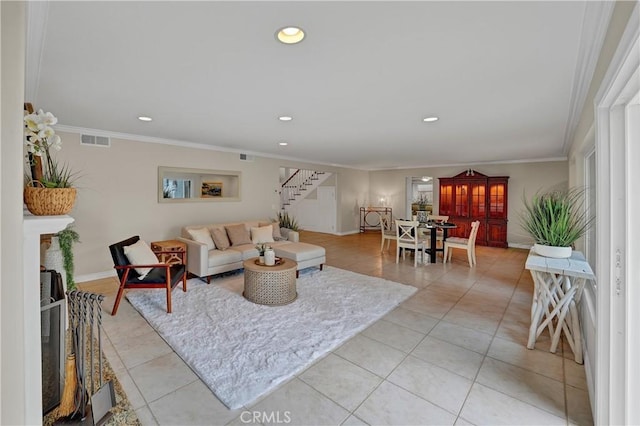 living room featuring crown molding and light tile patterned floors