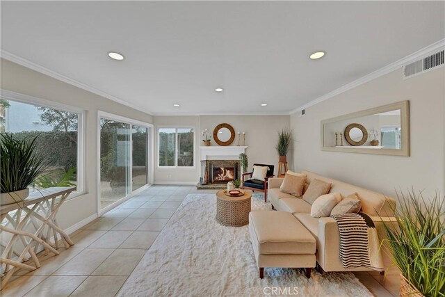 living room featuring light tile patterned floors and crown molding