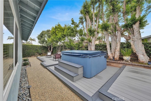 deck featuring a hot tub