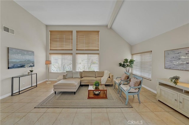 living room with light tile patterned floors, beam ceiling, and high vaulted ceiling