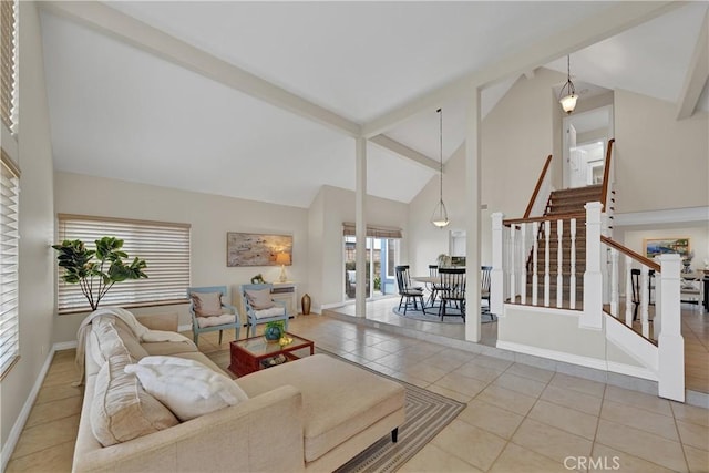 living room with beamed ceiling, light tile patterned floors, and high vaulted ceiling