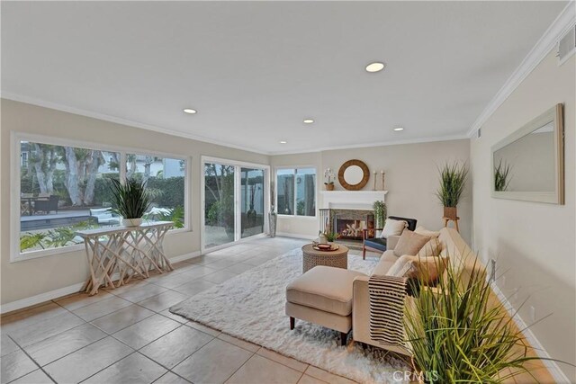 tiled living room with crown molding and plenty of natural light