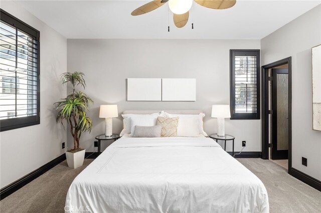 carpeted bedroom with ceiling fan