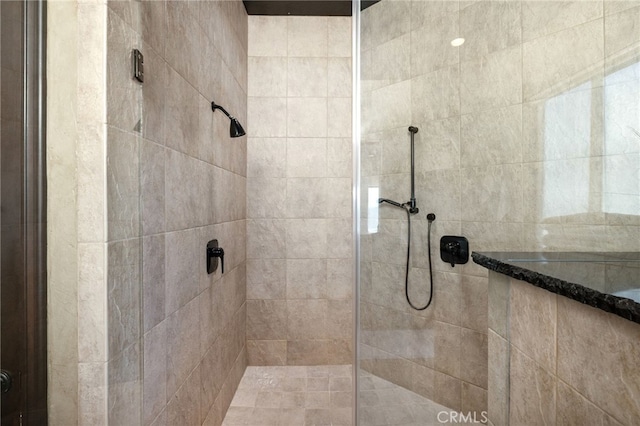 bathroom with a tile shower