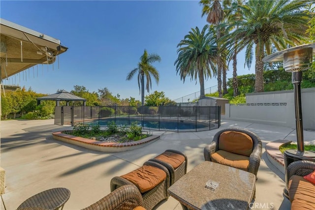 view of swimming pool featuring a patio area and a gazebo