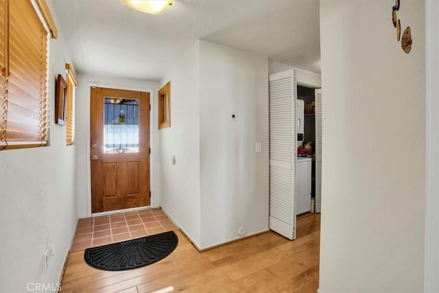 foyer entrance with light wood-type flooring