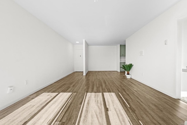 empty room with hardwood / wood-style floors