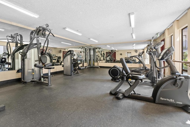 gym with a textured ceiling