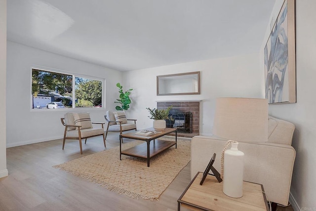 living room featuring a fireplace and hardwood / wood-style flooring