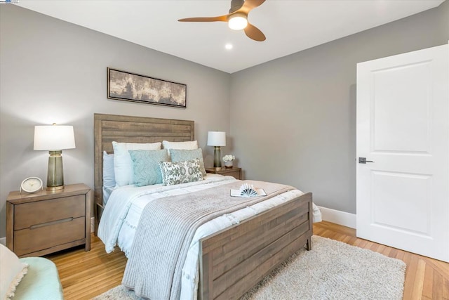 bedroom featuring ceiling fan and light hardwood / wood-style flooring