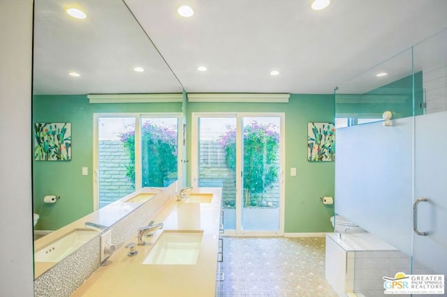 bathroom featuring toilet, a shower with door, and vanity