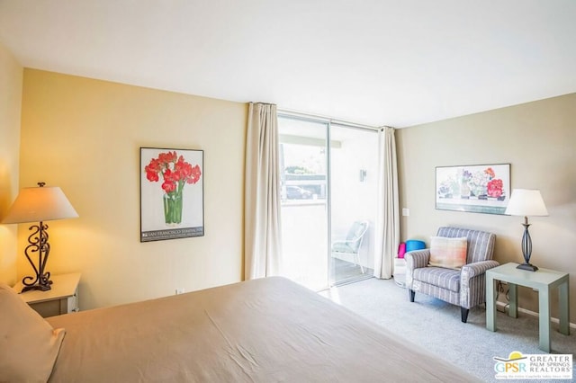 carpeted bedroom featuring access to outside and floor to ceiling windows