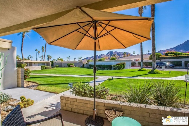 view of patio / terrace featuring a mountain view