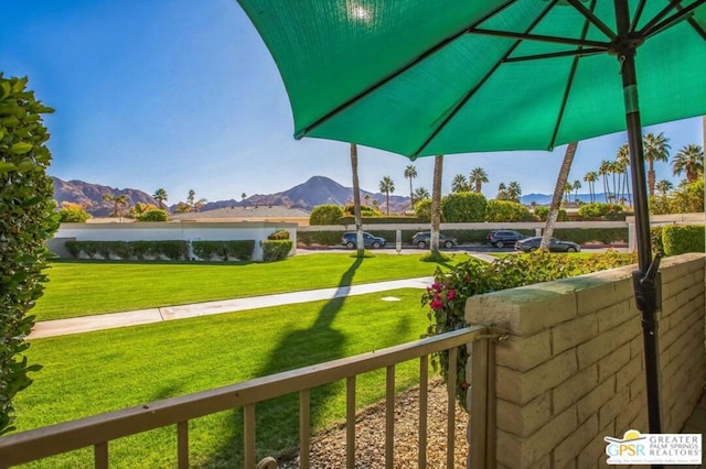 view of yard featuring a water and mountain view